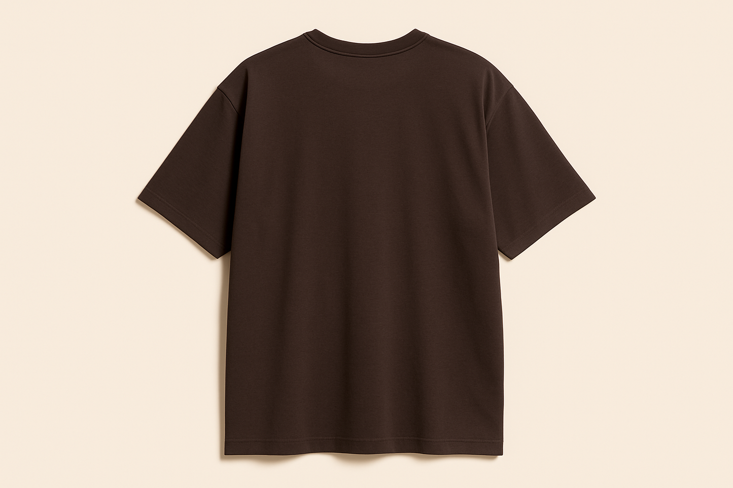 Professional e-commerce product photography of an oversized dark brown crew neck t-shirt displayed without a model, showing the back view against a neutral beige background with studio lighting